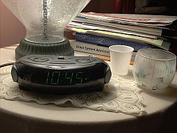 [Nightstand lamp and clock]