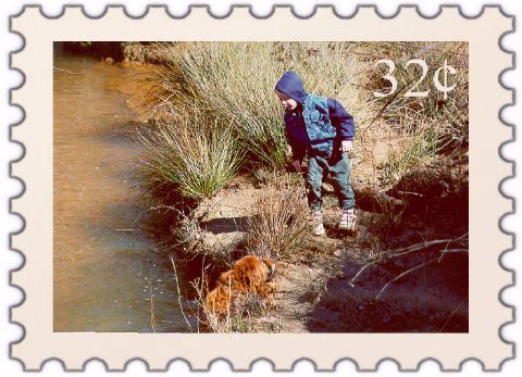 [Joshua with Megan, our dog - Winter 1999]