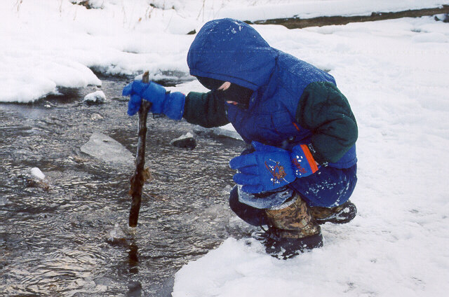 [Joshua hunts in Grandpa Karg's creek - December 2000]