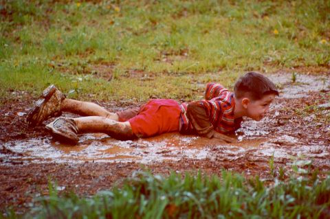 [Joshua playing in the mud - Spring 2000]